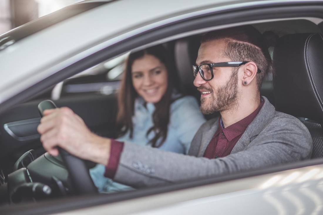 Couple is driving in a car